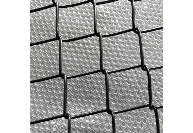 Chain link fence mesh stretching and attachment to top rail and posts during installation